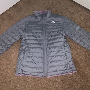 grey and purple north face jacket